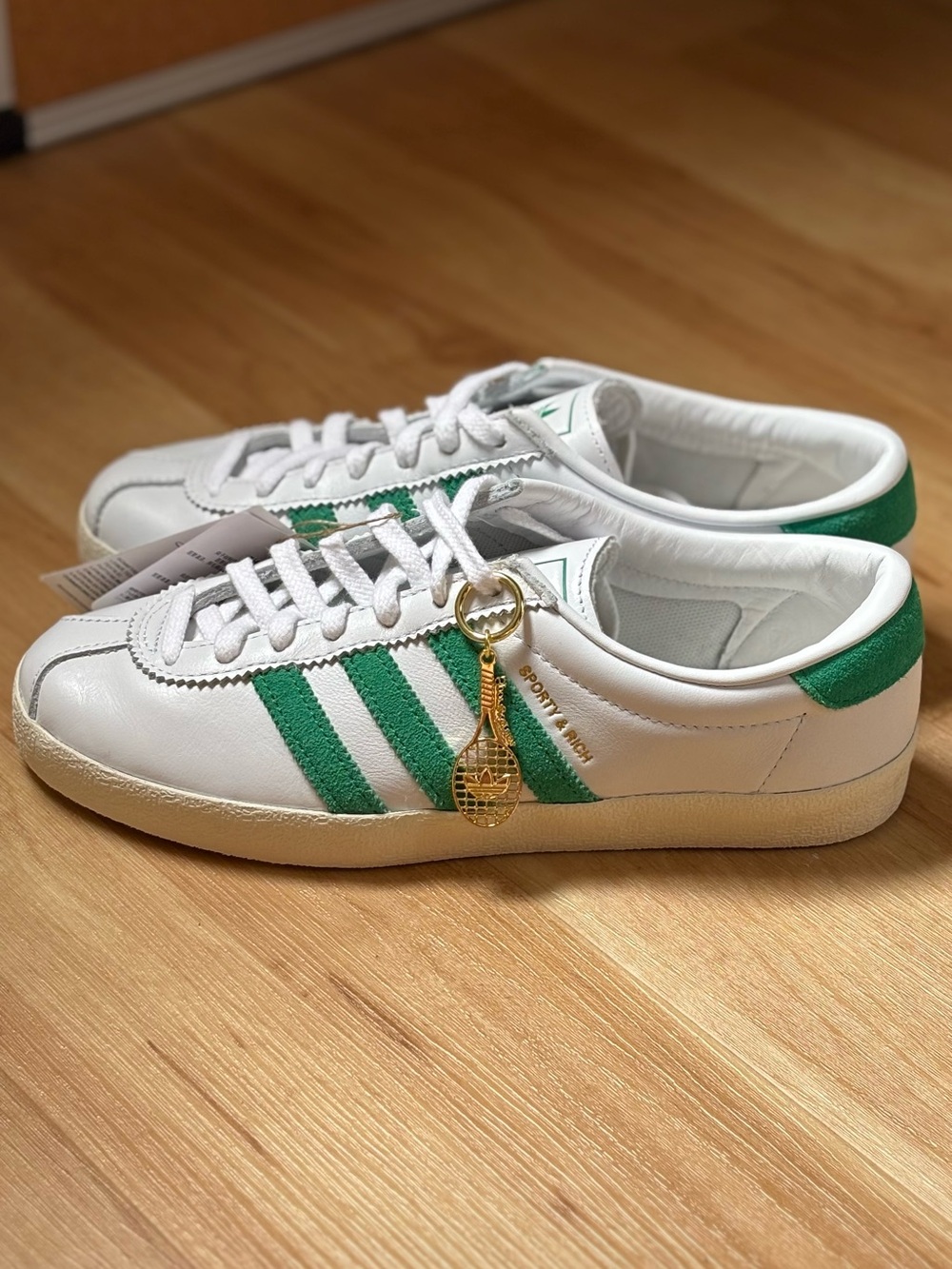 adidas White Sneakers with Green Stripes and Gold Charm